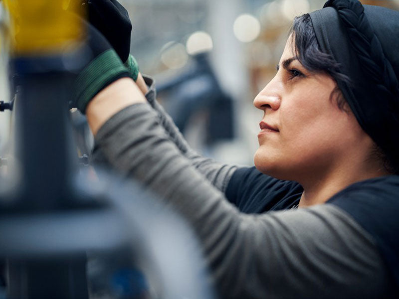 A woman working at Riese and Muller