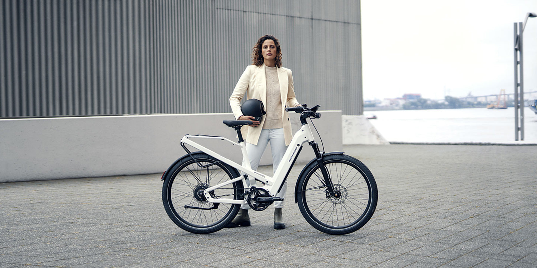 A woman with a Riese and Muller Homage electric bike