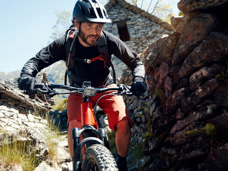 Man riding his Riese and Muller Delite Mountain electric bike.