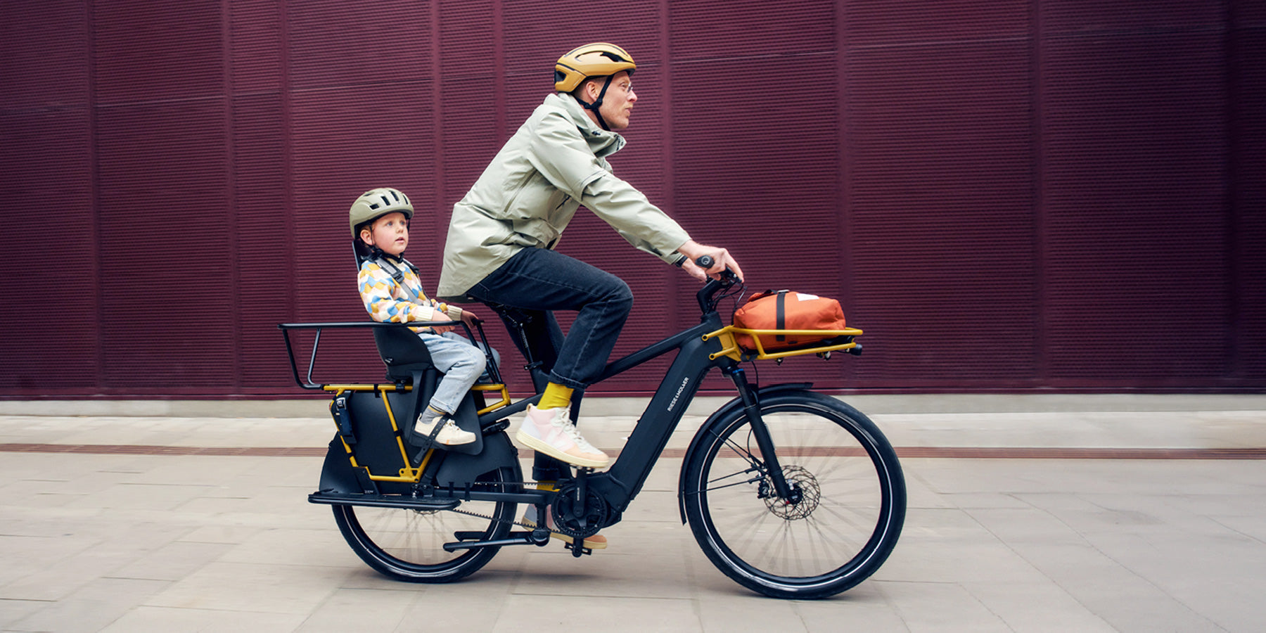 Man and child on a Riese and Muller Multicharger2 electric bike