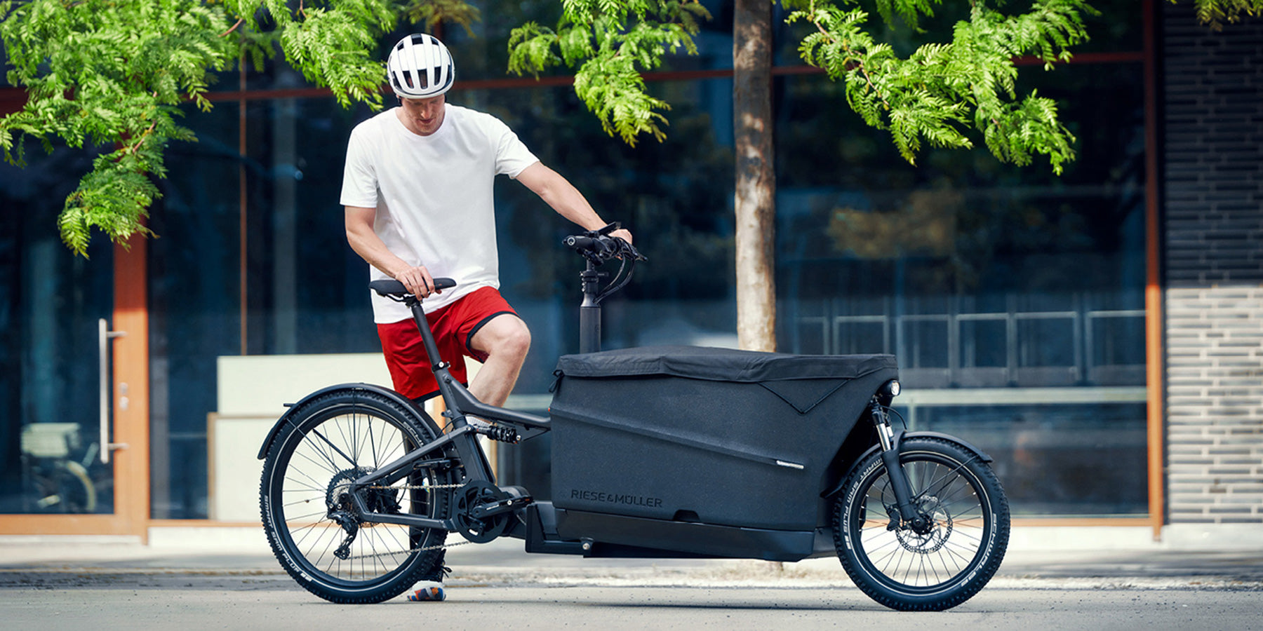 A man with his Riese and Muller Packster2 70 electric cargo bike